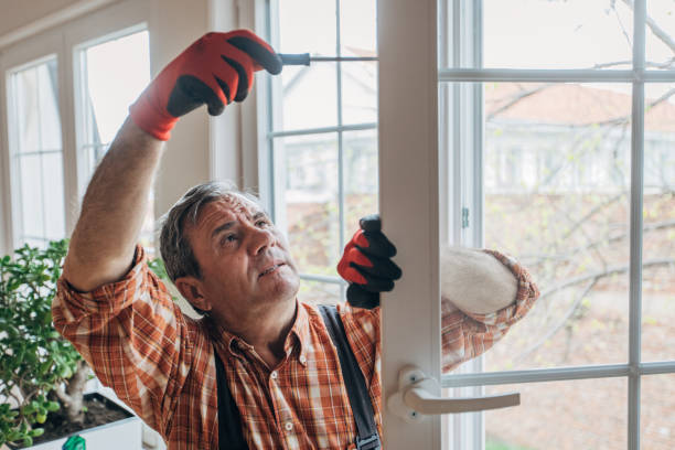 A worker installs windows
