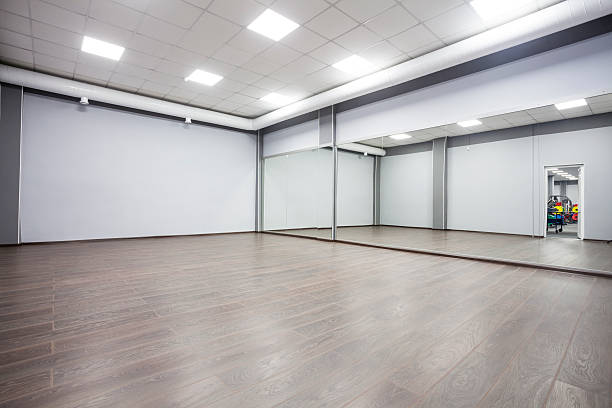 empty modern gymnastics room with mirrors on walls
