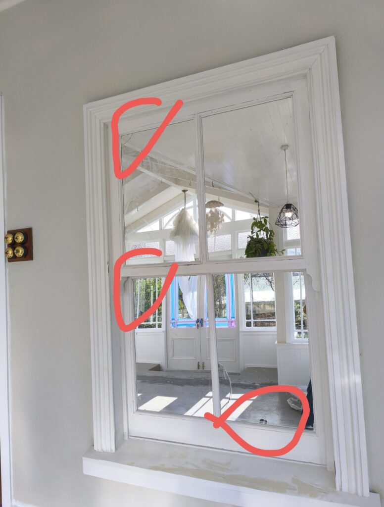 (marked image)It is an abnormal and interesting mirror design indoor as a fake window to let lights in and double the view of the living room. But the mirrors were broken and need to repair
